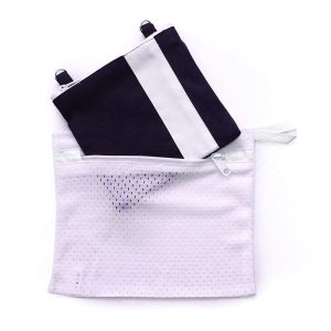 Image of a Mini Essentials Bag sliding into the wash bag for cleaning