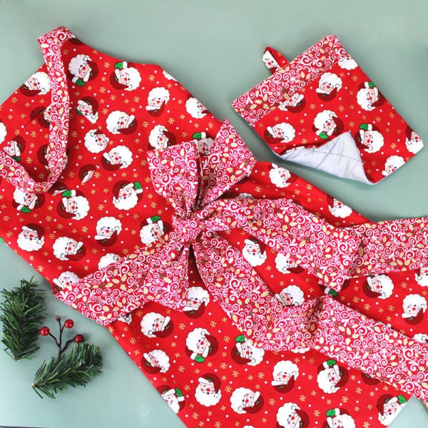 photo of Garment Saver Sash Tie Apron Set in Holly Jolly pattern (flat view)